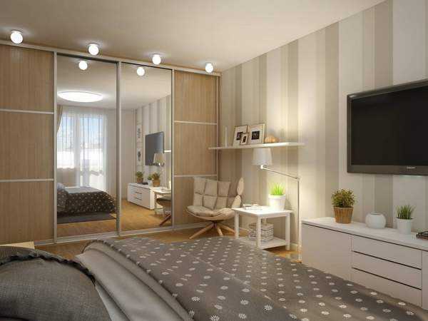 Интерьер однокомнатной квартиры с кроватью и диваном